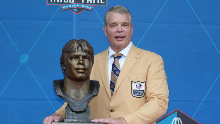 Aug 5, 2023; Canton, OH, USA; New York Jets and Indianapolis Colts former defensive lineman Joe Klecko poses with his bust during the 2023 Pro Football Hall of Fame Enshrinement at Tom Benson Hall of Fame Stadium. 