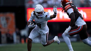 Cincinnati Bearcats wide receiver Noah Jennings (8) is tackled by Bowling Green Falcons cornerback MJ Cannon in the fourth quarter of the NCAA football game between the Cincinnati Bearcats and Bowling Green Falcons at Nippert Stadium in Cincinnati on Sept. 6, 2025.