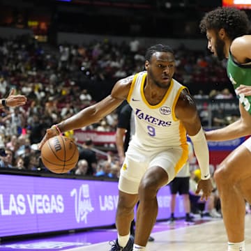 Jul 15, 2024; Las Vegas, NV, USA; Los Angeles Lakers guard Bronny James (9) dribbles the ball against Boston Celtics forward Anton Watson (28) during the first half at Thomas & Mack Center. Mandatory Credit: Lucas Peltier-Imagn Images