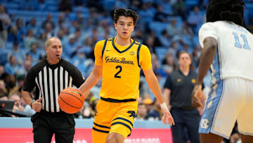 Jan 15, 2025; Chapel Hill, North Carolina, USA; California Golden Bears guard Andrej Stojakovic (2) dribbles as North Carolina Tar Heels guard Ian Jackson (11) defends in the first half at Dean E. Smith Center. Mandatory Credit: Bob Donnan-Imagn Images
