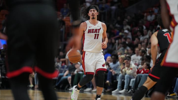 Apr 14, 2024; Miami, Florida, USA;  Miami Heat guard Jaime Jaquez Jr. (11) brings the ball up the court against the Toronto Raptors during the first half at Kaseya Center. Mandatory Credit: Jim Rassol-USA TODAY Sports