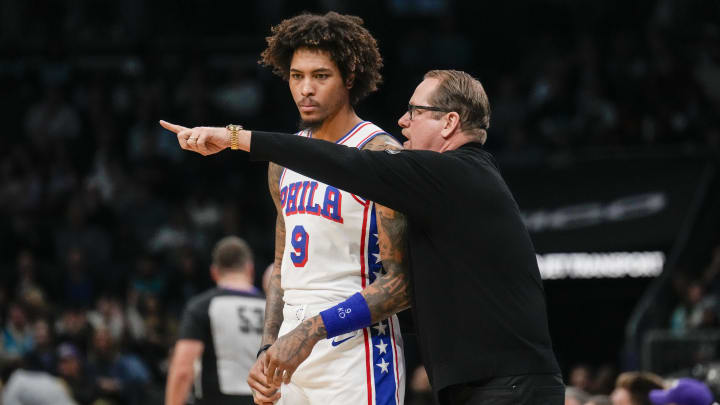 Dec 16, 2023; Charlotte, North Carolina, USA; Philadelphia 76ers head coach Nick Nurse reacts with guard Kelly Oubre Jr. (9) during the first quarter against the Charlotte Hornets at Spectrum Center. Mandatory Credit: Jim Dedmon-USA TODAY Sports