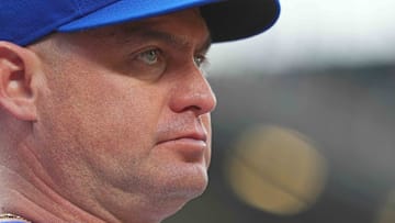 Jul 8, 2025; Baltimore, Maryland, USA; New York Mets manager Carlos Mendoza (64) watches from the dugout during the first inning against the Baltimore Orioles at Oriole Park at Camden Yards.