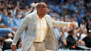 Mar 8, 2025; Chapel Hill, North Carolina, USA;  North Carolina Tar Heels head coach Hubert Davis reacts in the first half at Dean E. Smith Center. Mandatory Credit: Bob Donnan-Imagn Images