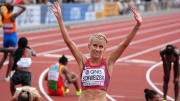 Jul 16, 2022; Eugene, Oregon, USA; Karissa Schweizer (USA) reacts at the end of the women's 10,000m during the World Athletics Championships Oregon 22 at Hayward Field. Mandatory Credit: Kirby Lee-USA TODAY Sports