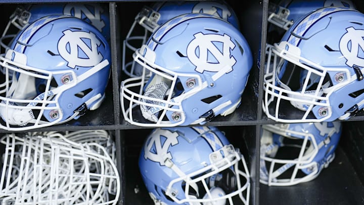 Sep 2, 2023; Charlotte, North Carolina, USA; North Carolina Tar Heels helmets during the first quarter against the South Carolina Gamecocks at Bank of America Stadium. Mandatory Credit: Jim Dedmon-Imagn Images Sep 2, 2023; Charlotte, North Carolina, USA; North Carolina Tar Heels helmets during the first quarter against the South Carolina Gamecocks at Bank of America Stadium. Mandatory Credit: Jim Dedmon-Imagn Images