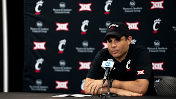 Cincinnati Bearcats head coach Wes Miller speaks at a podium at First Third Arena in Cincinnati on Wednesday, July 16, 2025.