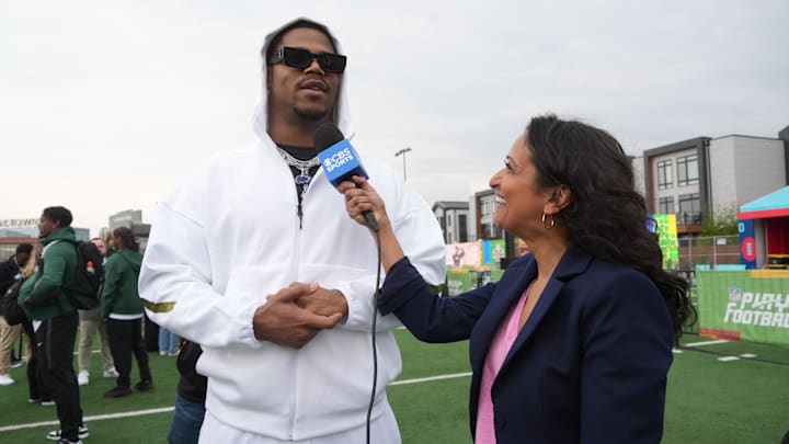 Penn State Nittany Lions defensive end Abdul Carter (left) is interviewed by CBS Sports reporter Aditi Kinkhabwala