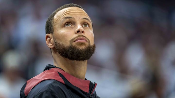 Golden State Warriors guard Stephen Curry looks on from the bench against the Minnesota Timberwolves in the second half. Golden State Warriors guard Stephen Curry looks on from the bench against the Minnesota Timberwolves in the second half.