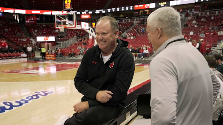 Head coach Greg Gard, left, speaks with broadcaster Matt Lepay before a Wisconsin men’s basketball scrimmage Sunday, October 19, 2025 at the Kohl Center in Madison, Wisconsin.
