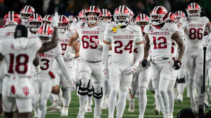 Indiana Hoosiers players enter the field for warm ups before a game between the Indiana Hoosiers and the Notre Dame Fighting Irish in first round of the College Football Playoff on Friday, Dec. 20, 2024, in South Bend.