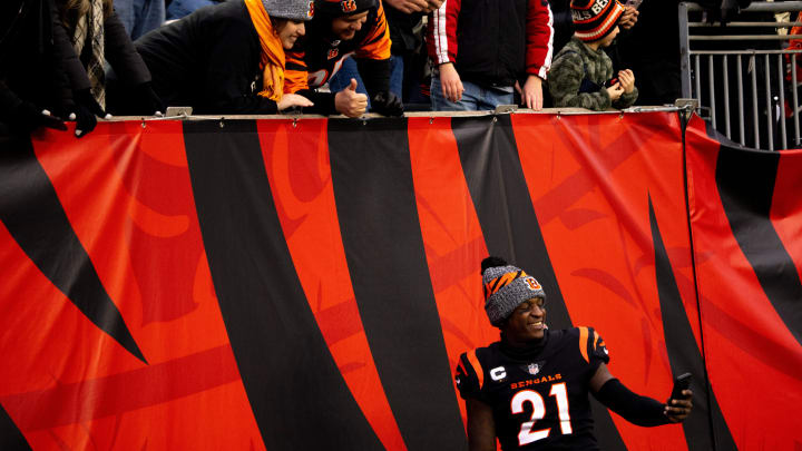 Cincinnati Bengals corner back Mike Hilton (21) takes a picture with fans in the fourth quarter of the NFL game between Cincinnati Bengals and Cleveland Browns at Paycor Stadium in Cincinnati on Sunday, Jan. 7, 2024.