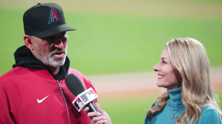 Apr 9, 2024; Denver, Colorado, USA; Arizona Diamondbacks manager Torey Lovullo (17) speaks to reporter Jody Jackson following the win over the Colorado Rockiesat Coors Field. Mandatory Credit: Ron Chenoy-USA TODAY Sports