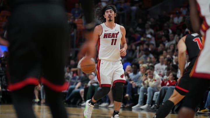 Apr 14, 2024; Miami, Florida, USA;  Miami Heat guard Jaime Jaquez Jr. (11) brings the ball up the court against the Toronto Raptors during the first half at Kaseya Center. Mandatory Credit: Jim Rassol-USA TODAY Sports