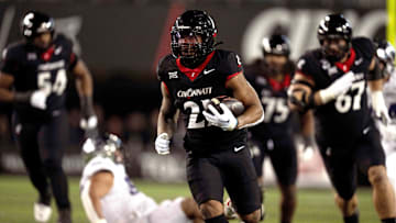 Nov 30, 2024; Cincinnati, Ohio, USA; Cincinnati Bearcats running back Corey Kiner (21) runs to the 1-yard line against the TCU Horned Frogs in the second quarter at Nippert Stadium. Mandatory Credit: Albert Cesare/USA TODAY Network via Imagn Images