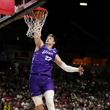 Jul 14, 2025; Las Vegas, NV, USA;  Utah Jazz forward Kyle Filipowski (22) dunks the ball against the San Antonio Spurs during the first half of a NBA basketball game at the Thomas & Mack Center. Mandatory Credit: Lucas Peltier-Imagn Images
