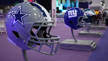 Large Dallas Cowboys and New York Giants helmets at the NFL Experience at the Mandalay Bay South Convention Center. 