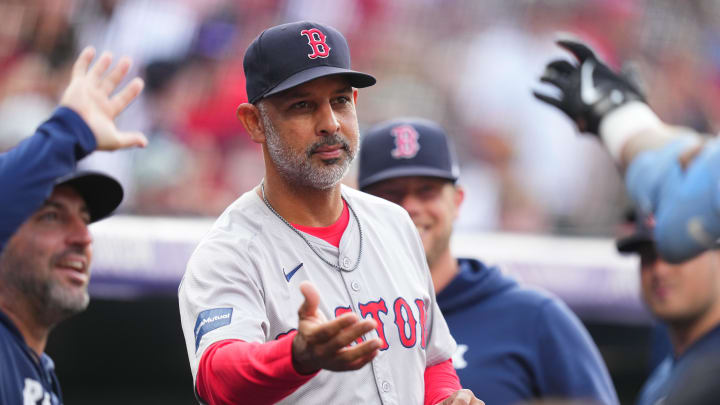 Jul 23, 2024; Denver, Colorado, USA; Boston Red Sox manager Alex Cora (13) celebrates a two-run home run scored by outfielder Tyler O'Neill (17) (not pictured) in the first inning against the Colorado Rockies at Coors Field. Mandatory Credit: Ron Chenoy-USA TODAY Sports