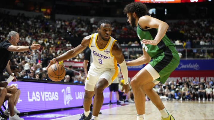 Jul 15, 2024; Las Vegas, NV, USA; Los Angeles Lakers guard Bronny James (9) dribbles the ball against Boston Celtics forward Anton Watson (28) during the first half at Thomas & Mack Center. Mandatory Credit: Lucas Peltier-USA TODAY Sports