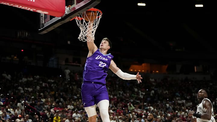 Jul 14, 2025; Las Vegas, NV, USA;  Utah Jazz forward Kyle Filipowski (22) dunks the ball against the San Antonio Spurs during the first half of a NBA basketball game at the Thomas & Mack Center. Mandatory Credit: Lucas Peltier-Imagn Images