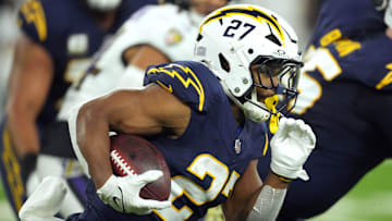Nov 25, 2024; Inglewood, California, USA; Los Angeles Chargers running back J.K. Dobbins (27) carries the ball against the Baltimore Ravens in the first half at SoFi Stadium. Mandatory Credit: Kirby Lee-Imagn Images