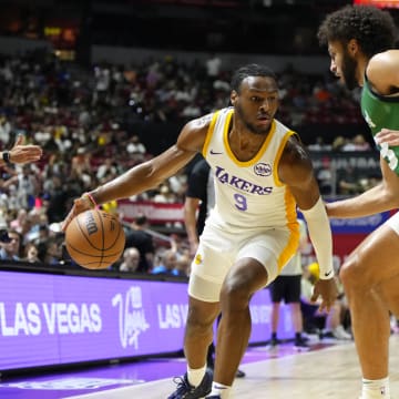 Jul 15, 2024; Las Vegas, NV, USA; Los Angeles Lakers guard Bronny James (9) dribbles the ball against Boston Celtics forward Anton Watson (28) during the first half at Thomas & Mack Center. Mandatory Credit: Lucas Peltier-USA TODAY Sports