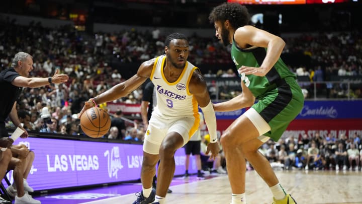 Jul 15, 2024; Las Vegas, NV, USA; Los Angeles Lakers guard Bronny James (9) dribbles the ball against Boston Celtics forward Anton Watson (28) during the first half at Thomas & Mack Center. Mandatory Credit: Lucas Peltier-USA TODAY Sports