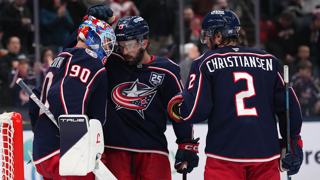 Blue Jackets defensemen Dante Fabbro and Jake Christiansen celebrate last night's win over the Leafs with Elvis Merzlikins. Blue Jackets defensemen Dante Fabbro and Jake Christiansen celebrate last night's win over the Leafs with Elvis Merzlikins.