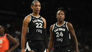 Aug 10, 2025; Las Vegas, Nevada, USA; Las Vegas Aces center A'ja Wilson (22) and guard Jewell Loyd (24) look on during the first half of a WNBA basketball game against the Connecticut Sun at Michelob Ultra Arena. Mandatory Credit: Lucas Peltier-Imagn Images