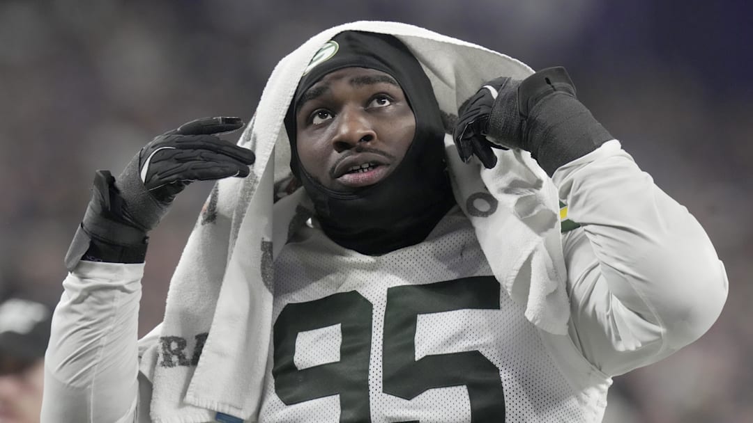 Dec 29, 2024; Minneapolis, Minnesota, USA; Green Bay Packers defensive tackle Devonte Wyatt (95) heads to the locker room during the third quarter against the Minnesota Vikings at U.S. Bank Stadium. Mandatory Credit: Mark Hoffman/USA TODAY NETWORK-Wisconsin via Imagn Images