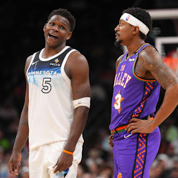 Mar 2, 2025; Phoenix, Arizona, USA; Minnesota Timberwolves guard Anthony Edwards (5) and Phoenix Suns guard Bradley Beal (3) talk during the second half at Footprint Center. 