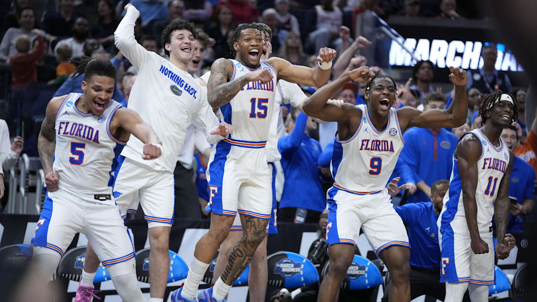 Mar 27, 2025; San Francisco, CA, USA; Florida Gators guard Alijah Martin (15), guard Will Richard (5) and center Rueben Chinyelu (9) celebrate on the Florida Gators bench during the second half against the Maryland Terrapins during a West Regional semifinal of the 2025 NCAA tournament at Chase Center. Mandatory Credit: Kyle Terada-Imagn Images