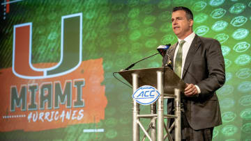 Jul 21, 2022; Charlotte, NC, USA;  Miami head coach Mario Cristobal talks to the media during the second day of ACC Media Days at the Westin Hotel in Charlotte, NC. Mandatory Credit: Jim Dedmon-USA TODAY Sports