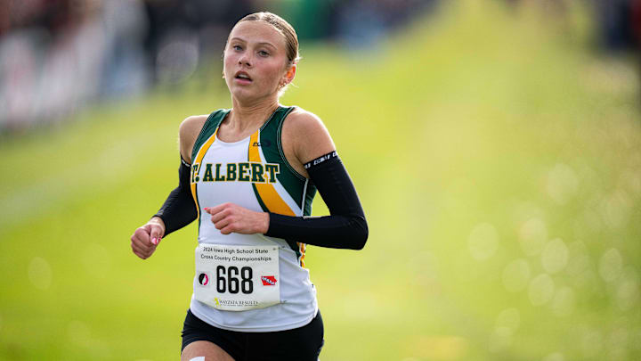 Lili Denton of Council Bluffs St. Albert set a new state track and field record Thursday as the Iowa high school state track and field championships began in Des Moines. Lili Denton of Council Bluffs St. Albert set a new state track and field record Thursday as the Iowa high school state track and field championships began in Des Moines.