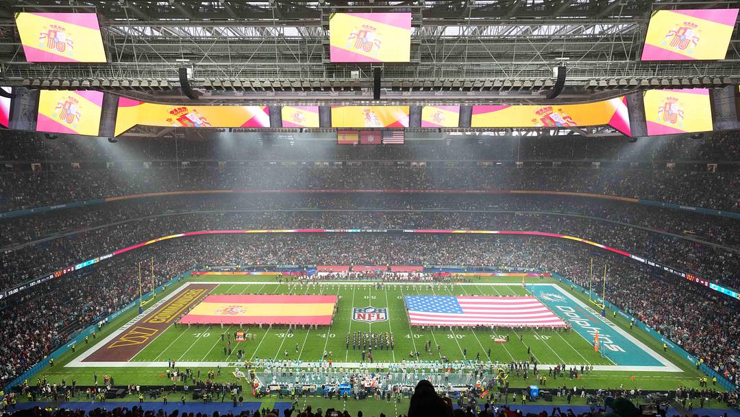 Flags on the field before the 2025 NFL Madrid Game between the Washington Commanders and the Miami Dolphins at Santiago Bernabeu Stadium. Mandatory Credit: Kirby Lee-Imagn Images