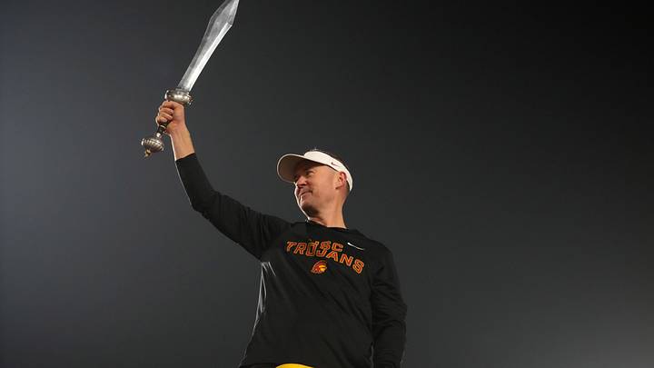 Nov 29, 2025; Los Angeles, California, USA; Southern California Trojans head coach Lincoln Riley leads the Spirit of Troy marching band in a rendition of Tribute to Troy after teh game against the UCLA Bruins at United Airlines Field at Los Angeles Memorial Coliseum. Mandatory Credit: Kirby Lee-Imagn Images