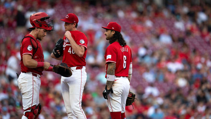 Cincinnati Reds catcher Tyler Stephenson (37) and Cincinnati Reds second baseman Jonathan India (6) conference with Cincinnati Reds starting pitcher Nick Lodolo (40) with the bases loaded in the third inning of the MLB game between the Cincinnati Reds and Kansas City Royals at Great American Ball Park in Cincinnati on Saturday, Aug. 17, 2024.