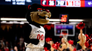 Cincinnati Bearcats mascot walks on the court during a timeout in the first half of a basketball scrimmage between Cincinnati Bearcats and Ohio State Buckeyes at Fifth Third Arena in Cincinnati on Friday, Oct. 18, 2024.