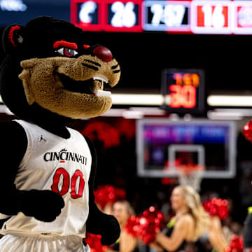 Cincinnati Bearcats mascot walks on the court during a timeout in the first half of a basketball scrimmage between Cincinnati Bearcats and Ohio State Buckeyes at Fifth Third Arena in Cincinnati on Friday, Oct. 18, 2024.