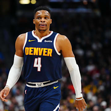 Dec 28, 2024; Denver, Colorado, USA; Denver Nuggets guard Russell Westbrook (4) looks on during the first quarter against the Detroit Pistons at Ball Arena. Mandatory Credit: Ron Chenoy-Imagn Images