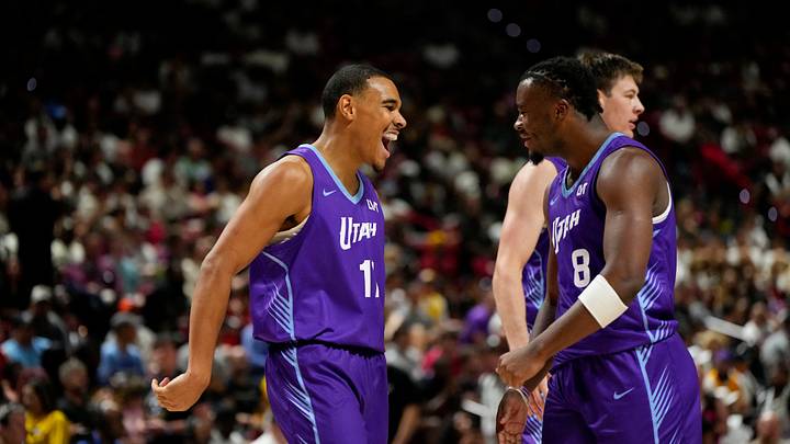 Jul 14, 2025; Las Vegas, NV, USA; Utah Jazz forward John Tonje (17) celebrates with guard Isaiah Collier (8) after scoring against the San Antonio Spurs during the second half of a NBA basketball game at the Thomas & Mack Center. Mandatory Credit: Lucas Peltier-Imagn Images