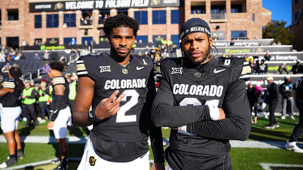 Colorado Buffaloes quarterback Shedeur Sanders (2) and safety Shilo Sanders (21) pose for a photo.