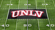 The UNLV Rebels logo at midfield during the Mountain West Championship at Allegiant Stadium. Mandatory Credit: Kirby Lee-Imagn Images