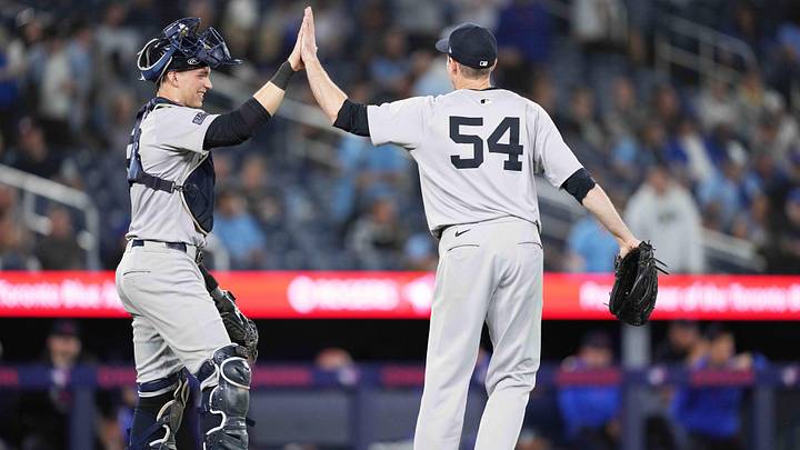 Jun 28, 2024; Toronto, Ontario, CAN; New York Yankees catcher Ben Rice (93) celebrates the win with New York Yankees relief pitcher Tim Hill (54) against the Toronto Blue Jays at Rogers Centre. Mandatory Credit: Nick Turchiaro-Imagn Images