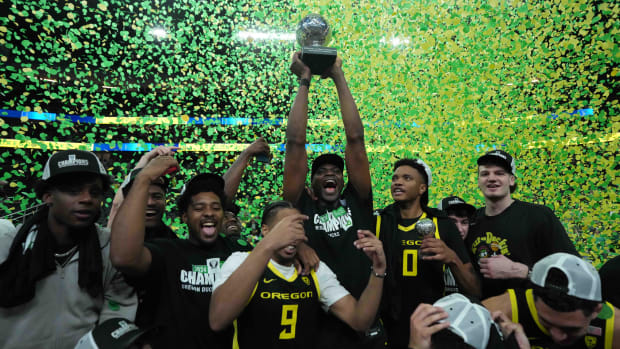 Oregon Ducks players celebrate after the Pac-12 Championship game against the Colorado Buffaloes at T-Mobile Arena.