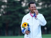 Aug 1, 2021; Tokyo, Japan; Xander Schauffele (USA) celebrates on the podium after winning the gold medal during the final round of the men's individual stroke play of the Tokyo 2020 Olympic Summer Games at Kasumigaseki Country Club. Mandatory Credit: Kyle Terada-USA TODAY Sports