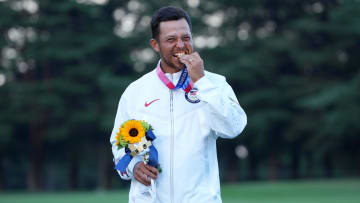 Aug 1, 2021; Tokyo, Japan; Xander Schauffele (USA) celebrates on the podium after winning the gold medal during the final round of the men's individual stroke play of the Tokyo 2020 Olympic Summer Games at Kasumigaseki Country Club. Mandatory Credit: Kyle Terada-USA TODAY Sports