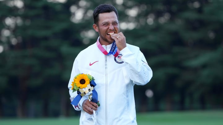 Aug 1, 2021; Tokyo, Japan; Xander Schauffele (USA) celebrates on the podium after winning the gold medal during the final round of the men's individual stroke play of the Tokyo 2020 Olympic Summer Games at Kasumigaseki Country Club. Mandatory Credit: Kyle Terada-USA TODAY Sports Aug 1, 2021; Tokyo, Japan; Xander Schauffele (USA) celebrates on the podium after winning the gold medal during the final round of the men's individual stroke play of the Tokyo 2020 Olympic Summer Games at Kasumigaseki Country Club. Mandatory Credit: Kyle Terada-USA TODAY Sports