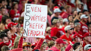 A Nebraska Cornhuskers fan holds a Taylor Swift-themed sign during the fourth quarter against the Cincinnati Bearcats at GEHA Field at Arrowhead Stadium.