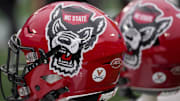 Dec 30, 2022; Charlotte, NC, USA; North Carolina State Wolfpack helmets during the first half against the Maryland Terrapins in the 2022 Duke's Mayo Bowl at Bank of America Stadium. Mandatory Credit: Jim Dedmon-Imagn Images